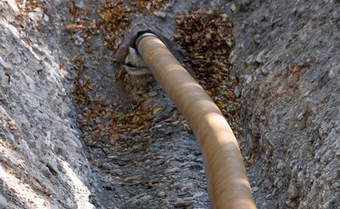 Bent pipeline in trench example photo